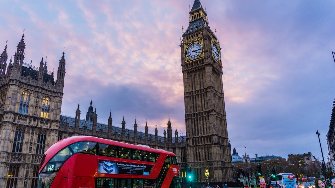 Elizabeth Tower and a red double-decker bus in London